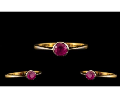 18ct Gold and Platinum Single Stone Ruby Set Ring. Marked 18ct to Interior of Shank. Est Ruby Weight 0.20 pts. Ring Size Q. S