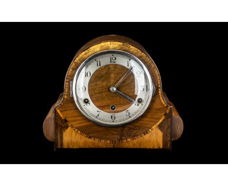 Westminster Chiming Mantel Clock of typical Napolean hat shape, striking on five bells. Walnut inlaid front with silver dial 