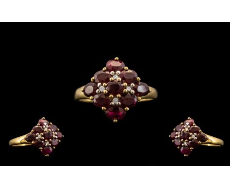 Ladies - 9ct Gold Attractive Ruby and Diamond Set Cluster Ring. Full Hallmark for 9.375 Gold. London Hallmark. The Nine Facet