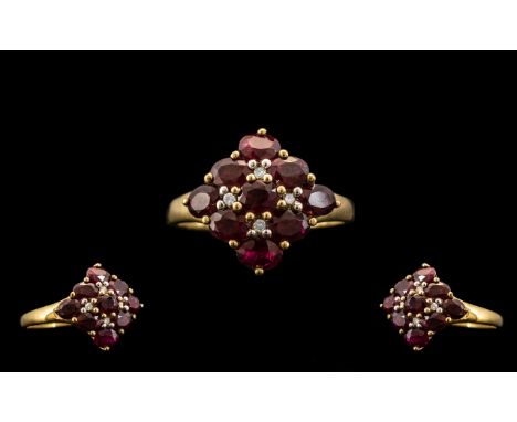 Ladies - 9ct Gold Attractive Ruby and Diamond Set Cluster Ring. Full Hallmark for 9.375 Gold. London Hallmark. The Nine Facet