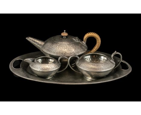 English Pewter Hand Crafted 1930s Fine Quality Hammered Pewter Three-Piece Tea Service with matching twin handle oval shaped 