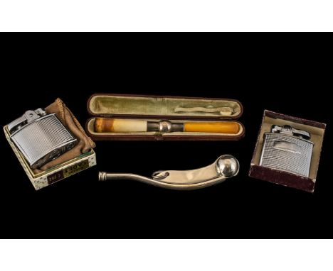Miscellaneous Lot comprising two vintage Ronson chrome cased petrol lighters, bosun's whistle and cased cigarette holder with