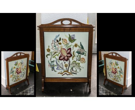 Edwardian Walnut Framed Fire Screen with a hand stitched embroidered panel depicting flowers, terminating on small shaped Que