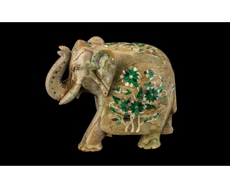 Inlaid Indian Soapstone Elephant with its trunk up, decorated to its back with a floral pattern, picked out in malachite and 