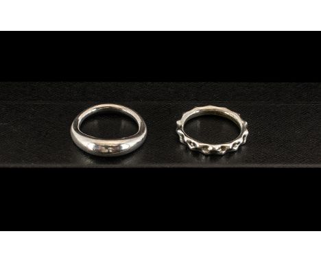 Two Sterling Silver Pandora Rings comprising a twirling band ring marked 925 ALE ring size K, and a heavy ring marked 925 ALE