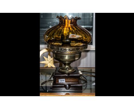 Large Converted Oil Lamp raised on wooden base, with large amber glass fluted edge shade, with flex.  Approx 20'' tall.  