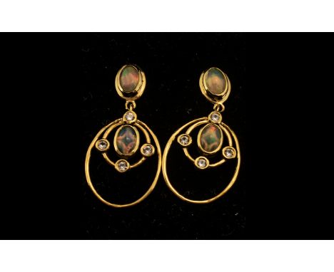 Natural Ethiopian Opal Drop Earrings, oval cut cabochons of opal, with an excellent display of colours, bezel set to both the
