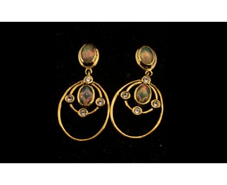 Natural Ethiopian Opal Drop Earrings, oval cut cabochons of opal, with an excellent display of colours, bezel set to both the