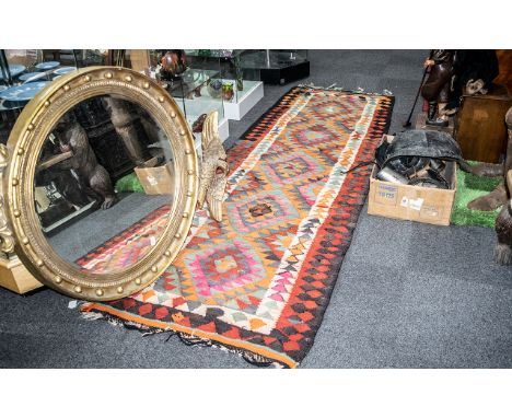 Large Turkish Kelim Tribal Weave Carpet with a coloured geometric design, 11 feet (330cms) x 3.5 feet (105cms) (a/f)