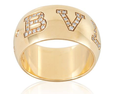 A DIAMONG MONOLOGO RING, BULGARI in 18ct yellow gold, the bevelled band signed BVLGARI, jewelled with round cut diamonds, sta