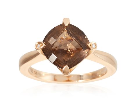 A SMOKEY QUARTZ AND DIAMOND DRESS RING, CARTIER in 18ct yellow gold, set with a faceted smokey quartz and two diamond sparks,