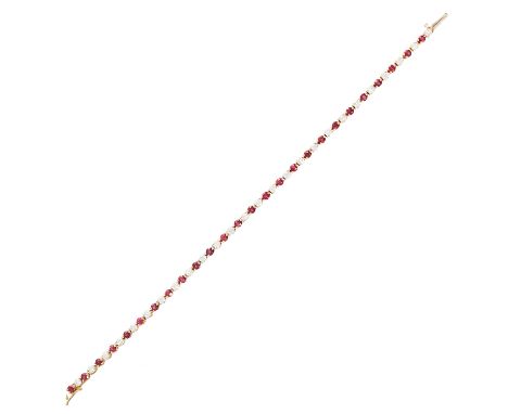 A RUBY AND DIAMOND LINE BRACELET, ASPREY &amp; CO in 18ct yellow gold, comprising of alternating round cut diamonds, totallin