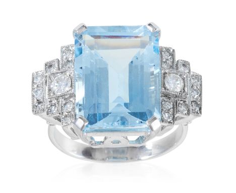 AN ART DECO AQUAMARINE AND DIAMOND DRESS RING in platinum or white gold, the emerald cut aquamarine of 11.92 carats between s