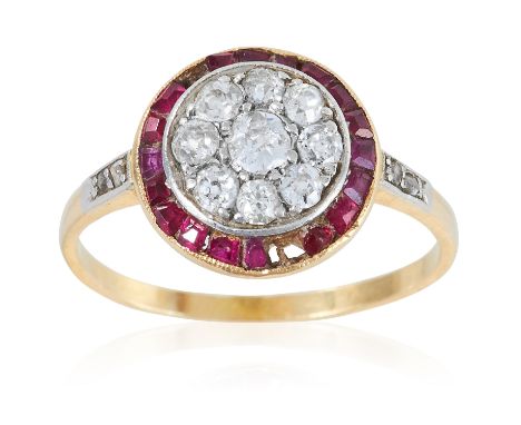 AN ART DECO DIAMOND AND RUBY RING in high carat yellow gold, the central cluster of old cut diamonds within a border of calib