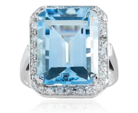 AN AQUAMARINE AND DIAMOND RING in platinum or white gold set with a step cut aquamarine of 11.42 carats encircled by round cu