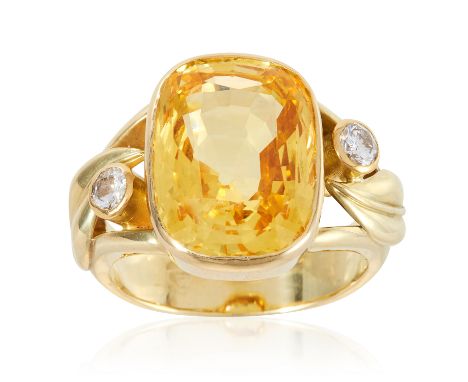 A 12.10 CARAT CEYLON NO HEAT YELLOW SAPPHIRE AND DIAMOND RING in high carat yellow gold, the cushion cut yellow sapphire of 1
