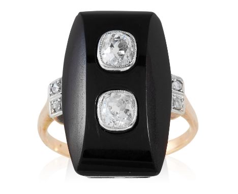 AN ART DECO ONYX AND DIAMOND RING in yellow gold, the polished onyx face in jewelled with two old cut diamonds, with further 