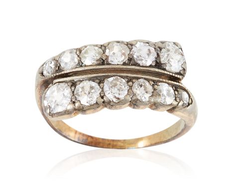 AN ANTIQUE DIAMOND DRESS RING in yellow gold, set with two rows of twelve old cut diamonds, unmarked, size K / 5, 3.12g.