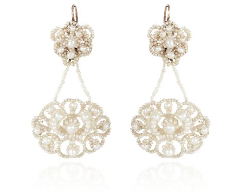 A PAIR OF ANTIQUE NATURAL PEARL EARRINGS, EARLY 19TH CENTURY each formed of an oval drop with seed pearl patterns sewn to a m
