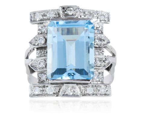 AN ART DECO AQUAMARINE AND DIAMOND RING in platinum or white gold, the emerald cut aquamarine of 7.38 carats within a geometr