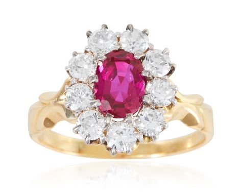 A 1.38 CARAT BURMA NO HEAT RUBY AND DIAMOND RING in 18ct yellow gold, the oval cut ruby encircled by round cut diamonds total