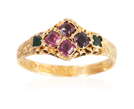 AN ANTIQUE GARNET AND EMERALD RING, CIRCA 1870 in 15 carat yellow gold, set with a quatrefoil motif of cushion cut garnets fl