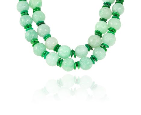 A JADE AND DIAMOND BEAD NECKLACE in white gold or platinum, comprising of alternating carved jade beads and polished jade dis