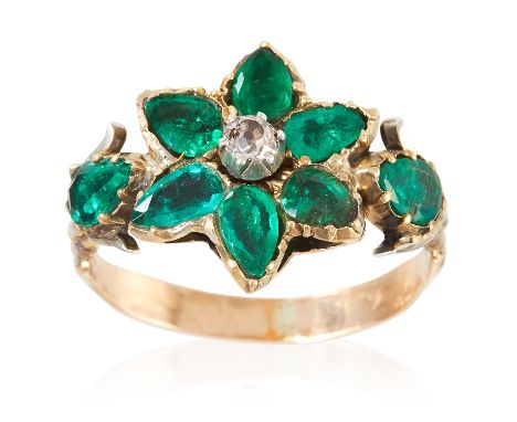 AN ANTIQUE EMERALD AND DIAMOND RING, 19TH CENTURY in high carat yellow gold, the floral motif jewelled with a round cut diamo