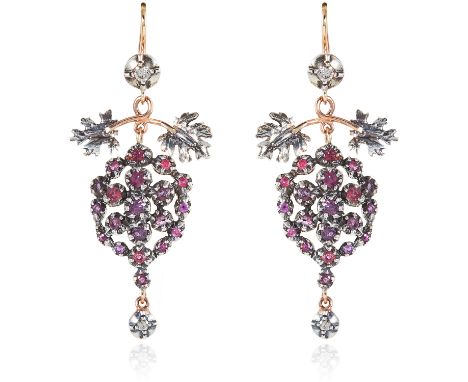 A PAIR OF RUBY AND DIAMOND EARRINGS in gold and silver, the articulated bodies set with round cut rubies accented by diamonds