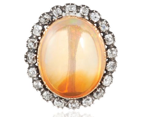 AN OPAL AND DIAMOND BROOCH in yellow gold, set with a cabochon opal of approximately 13.61 carats, in a border of old cut dia