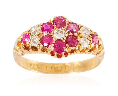AN ANTIQUE RUBY AND DIAMOND RING, EARLY 20TH CENTURY in 18ct yellow gold, the floral motifs relieved in rubies and diamonds, 