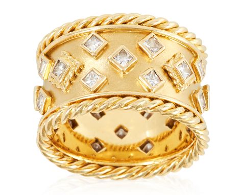 A DIAMOND DRESS RING, MANNER OF ELIZABETH GAGE in high carat yellow gold, the band jewelled with princess cut diamonds betwee