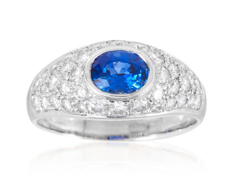 A CEYLON SAPPHIRE AND DIAMOND DRESS RING in 18ct white gold, set with an oval cut sapphire of 1.08 carats and round cut diamo