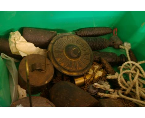 Four brass cased longcase weights, a box of assorted weights, mostly for wall clocks, a bag of cord and 'cat gut' and a clock