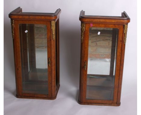 A pair of French burr walnut narrow display cabinets, both fitted one glass shelf, glazed on three sides with gilt metal moun