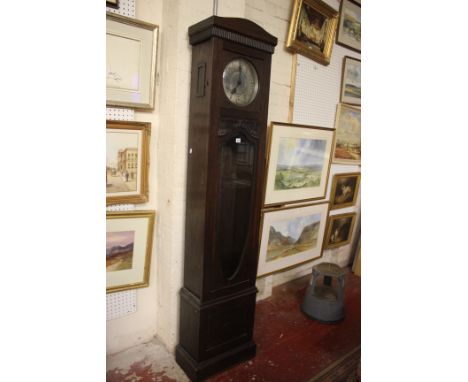 A 1930's oak cased longcase clock with circular pewter dial, 30hr chiming movement, with pendulum, incomplete, 214cm high 