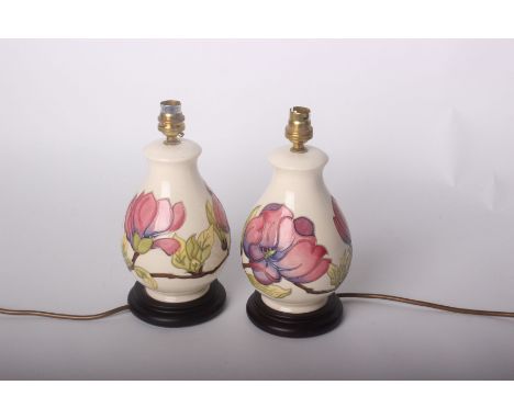 A pair of Moorcroft table lamps complete with shades, height of lamp 28cm (Sold as Parts)