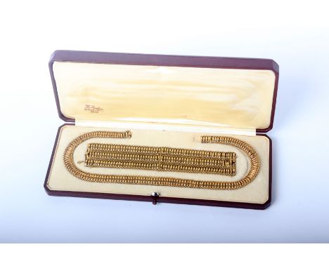 An early 20th century French gold three-row bracelet and a matching single row necklace in the form of open oval links with s