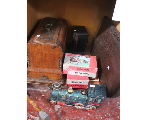 A mixed lot including a manual sewing machine, shove half penny board, two boxed Gje Gje trotting sets, razor, clock, etc.,