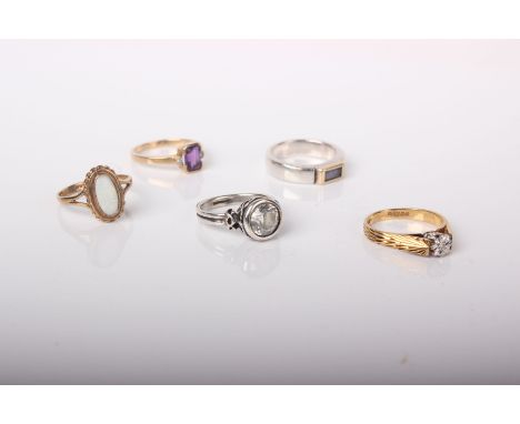 Five rings, comprising; an 18ct gold and tiny diamond solitaire ring, 3g; a 9ct gold, rectangular amethyst and tiny diamond t