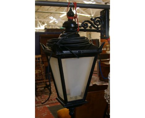 An aluminium frame 19th century style hanging lantern with bracket and plastic sides imitating frosted glass, height 85cm (So