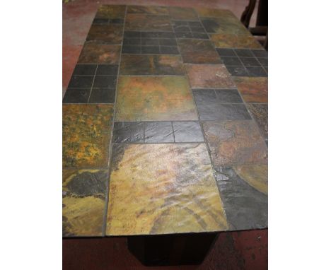 A slate tile top dining table with shaped stands, top 173cm x 101cm