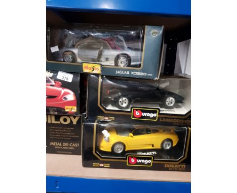 5 BOXED MODEL CARS BY BURAGO AND MAISTO