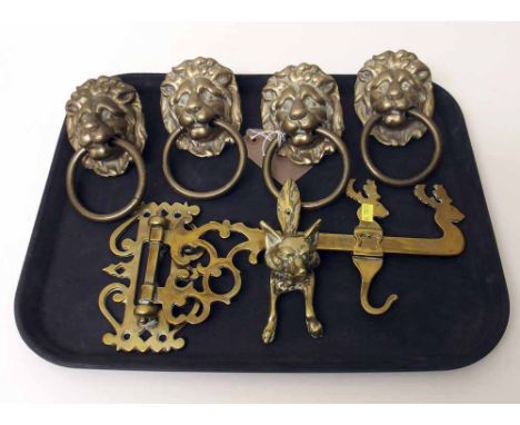Four brass lion mask handles, door knocker and hearth stand. Condition report: see terms and conditions.