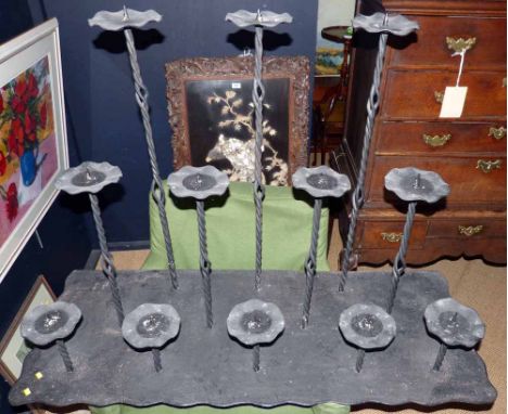 Cast iron 12 stick candle holder. Condition report: see terms and conditions.