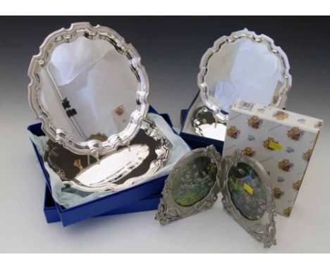 3 x 21cm and 2 x 25cm EPChippendale salvers; three fancy pewter photo frames.  This lot is sold subject to V.A.T. Therefore £