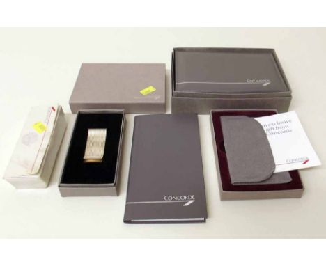 In flight gift Concord playing card case, money clip, business card case and note book. Condition report: see terms and condi
