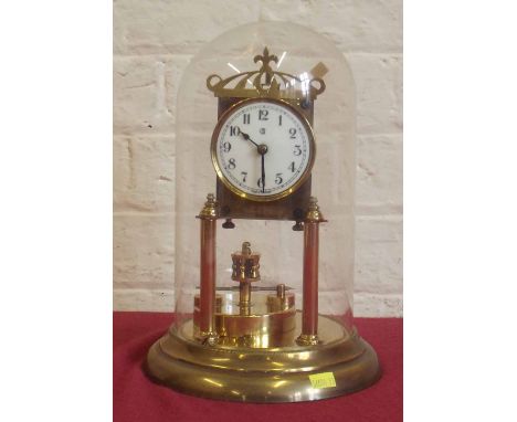 German torsion clock under a glass dome. Condition report: see terms and conditions.