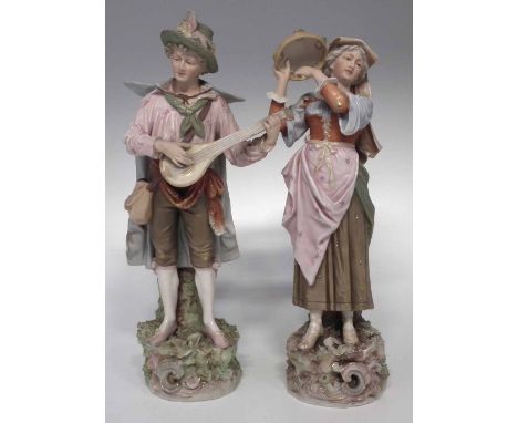 Two Royal Dux figures of musicians, the lady plays a tambourine, the gentleman a lute shaped guitar, no marks except impresse