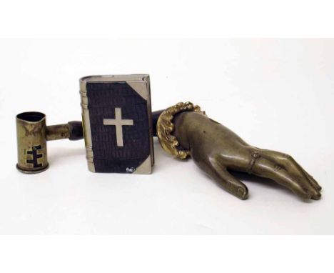Brass ornament in the form of a hand, cigarette lighter in the form of a Bible and brass shot measure. Condition report: see 